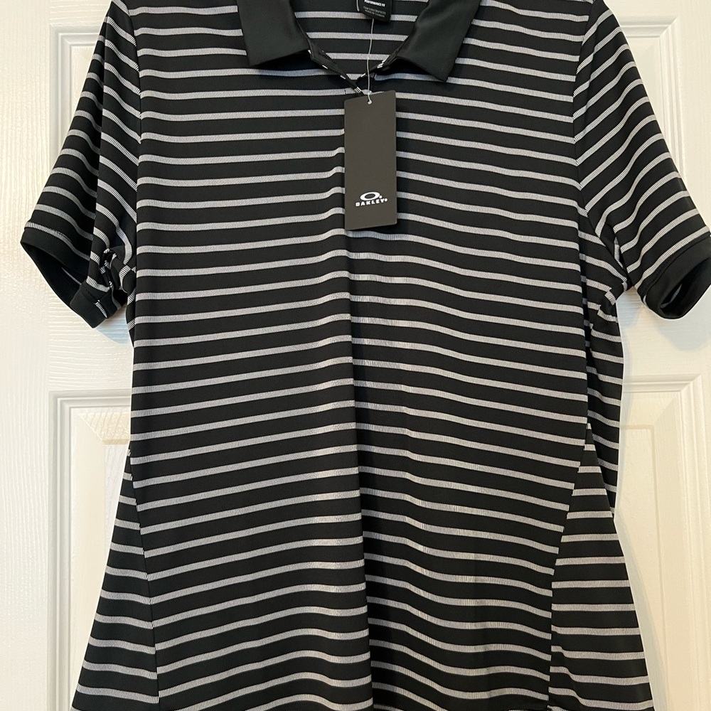 Oakley Golf. Women’s Black and white Striped Short Sleeve Polo